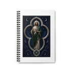 silver, indigo, and ivory San Judas Tadeo Silver Moon Quatrefoil illustration on a spiral notebook